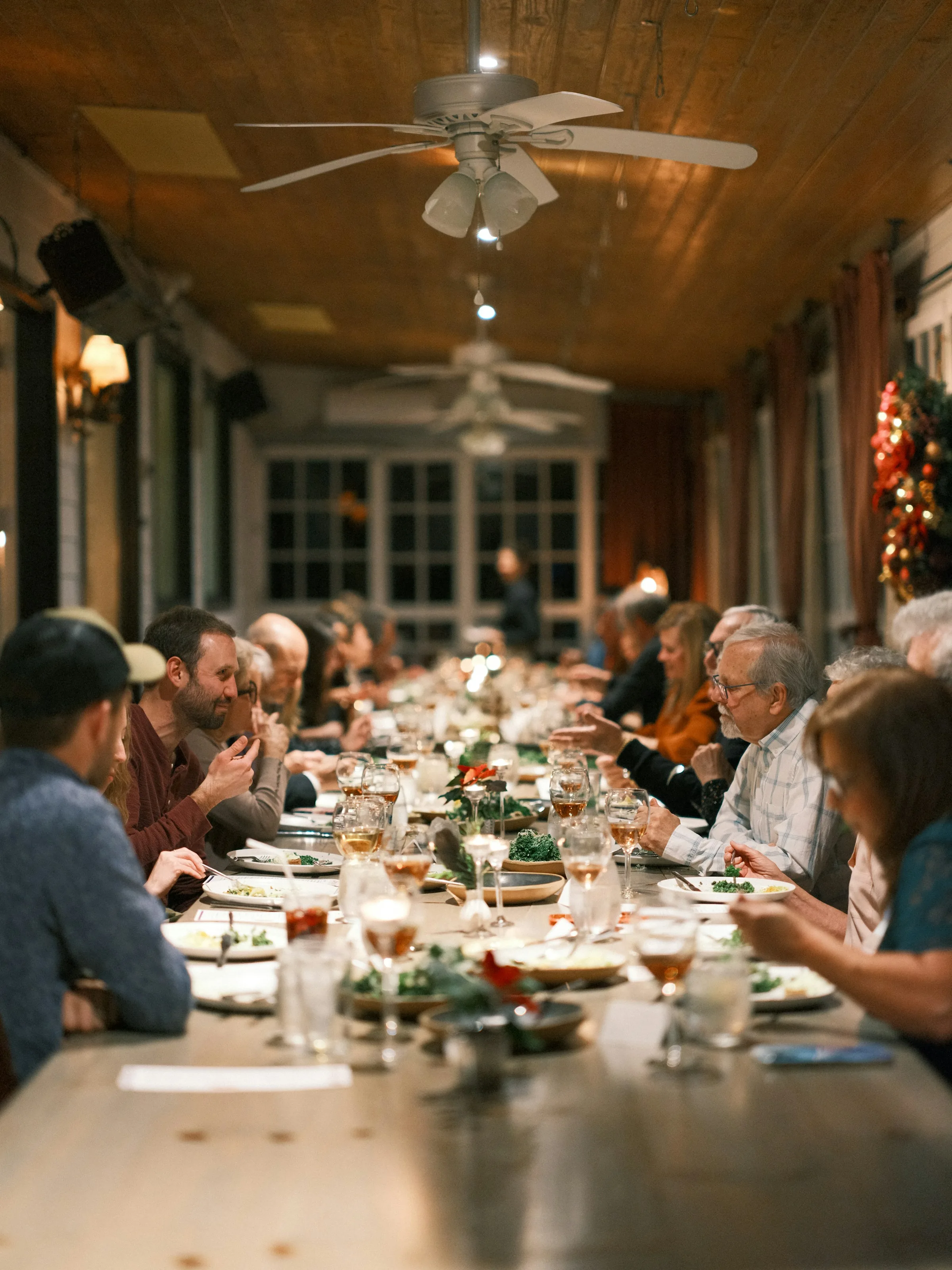 Long family table laid out in a garden, as at La Maladrerie